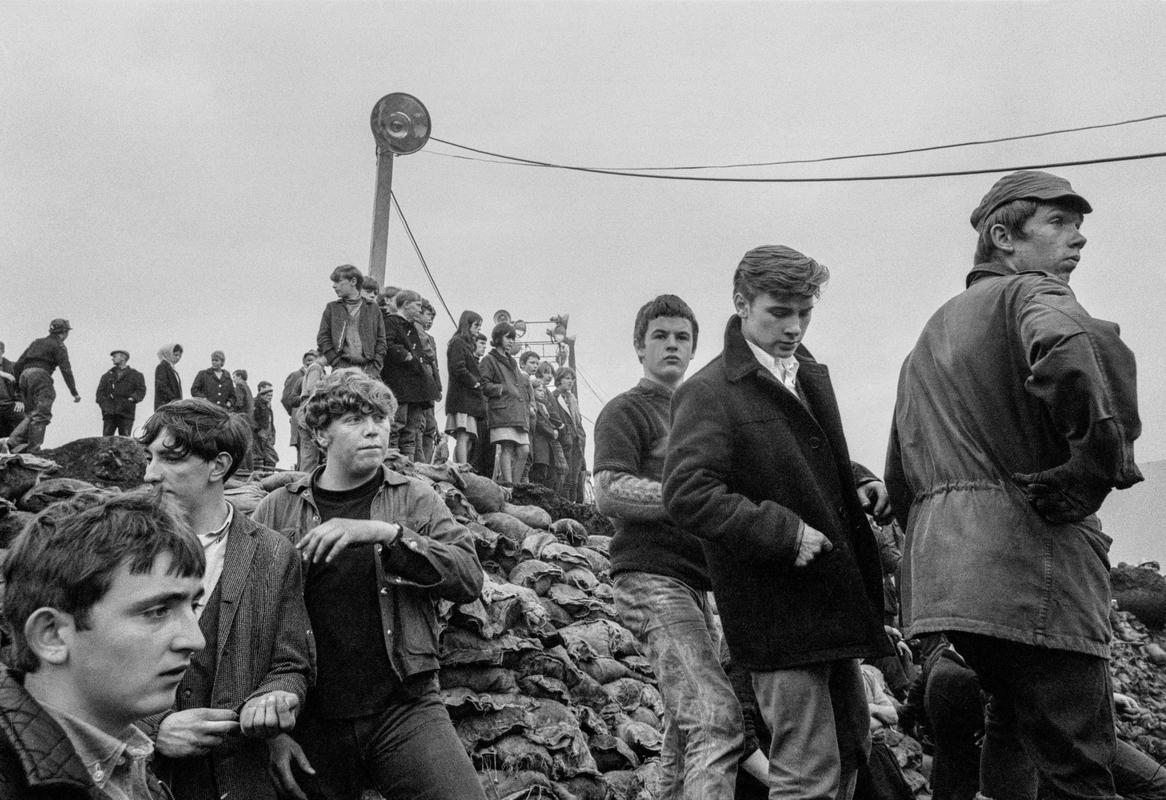 GB. WALES. The Aberfan disaster was a catastrophic collapse of a colliery spoil tip in the GB. Welsh village of Aberfan, on 21 October 1966, killing 116 children and 28 adults. It was caused by a build-up of water in the accumulated rock and shale, which suddenly started to slide downhill in the form of slurry. 1966