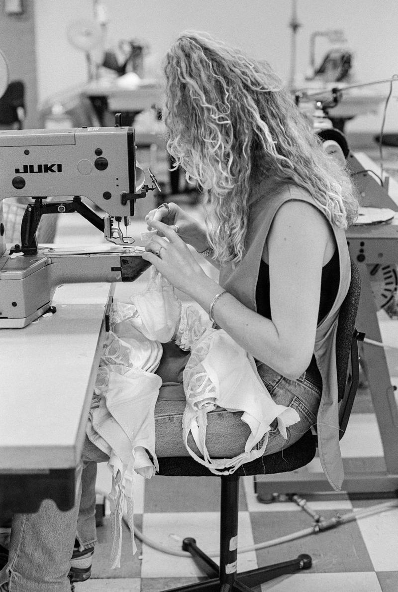 GB. WALES. South Wales employment. Gossards. For over 100 years manufacturers of Lingerie in the South Wales valleys. 65% of the workforce have worked with the firm for over 10 years. Most of the lingerie is made by hand. The workers work in teams of 15 and work out their own speed of output. 1998.