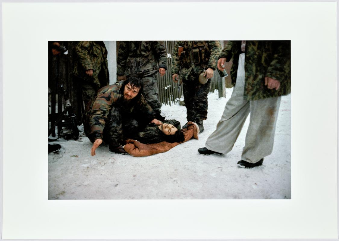 Chechen fighters try to save a injured comrade, who died few hours later.