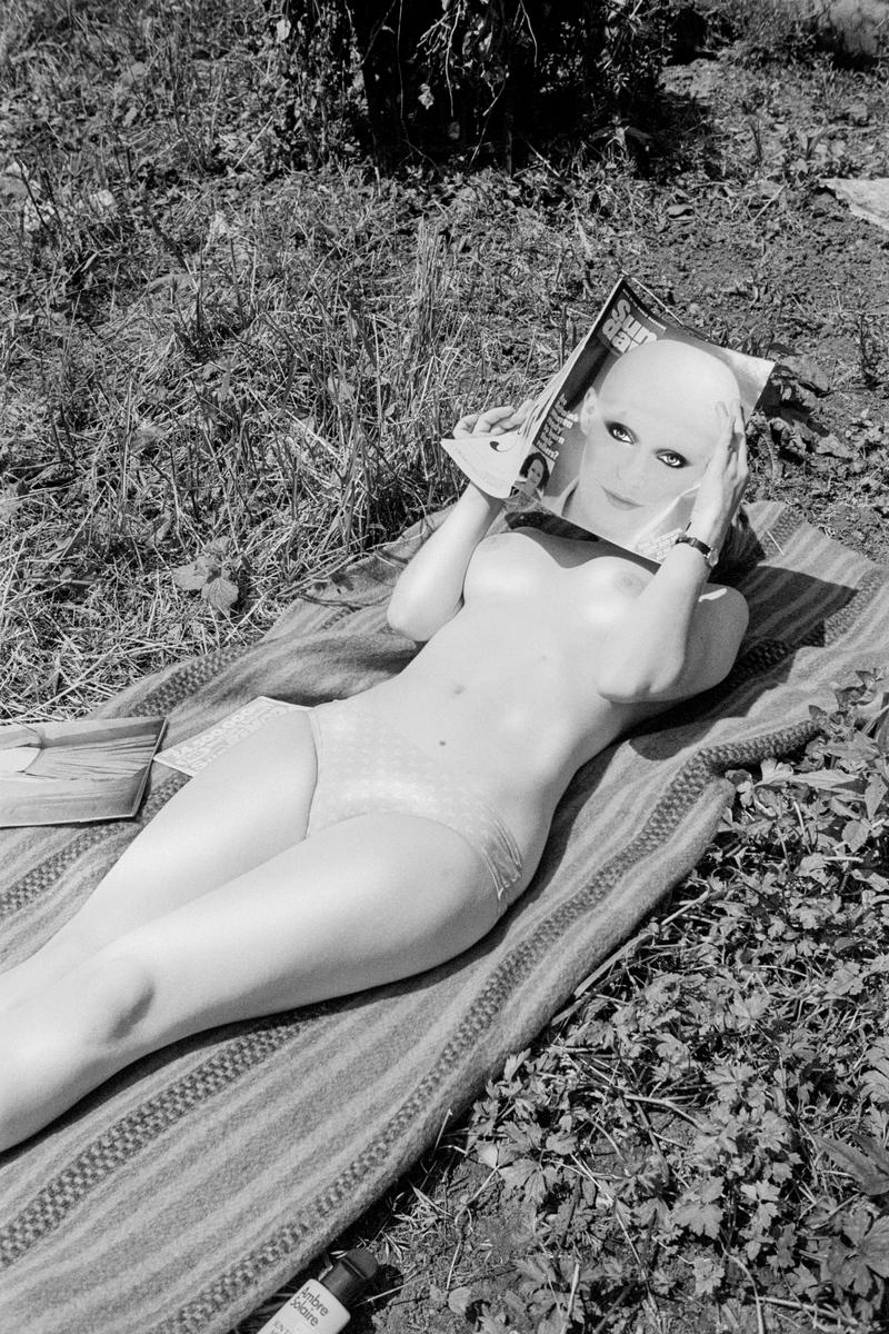 Reading in a Tintern garden. Wales. 1983