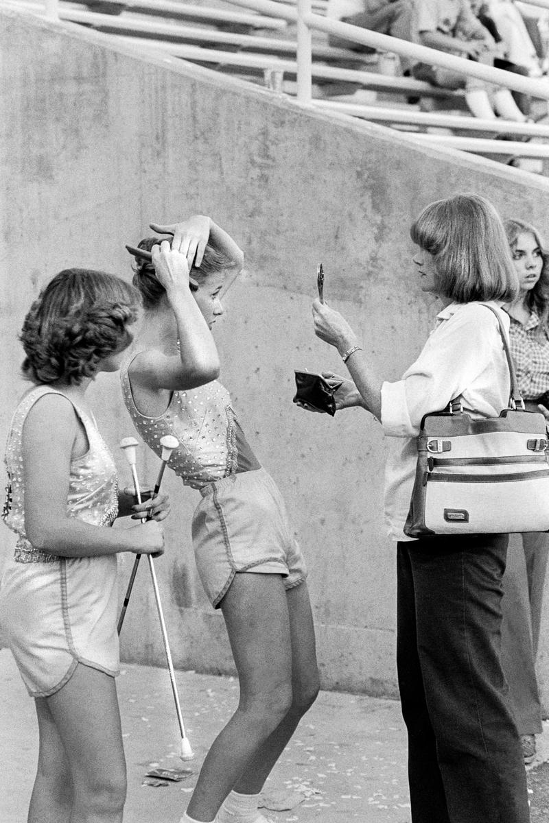 USA. ARIZONA. Tempe. A.S.U. v Utah football game. A high school mass band arrive for performance. 1979.