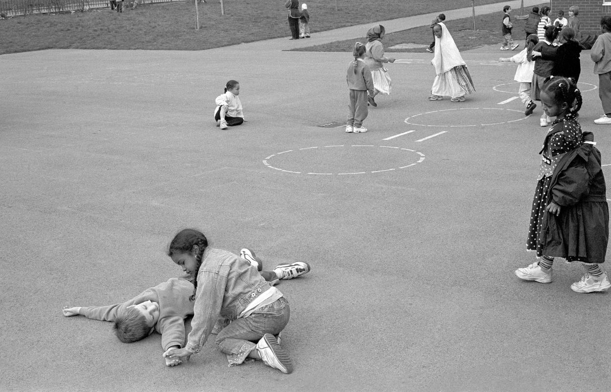 GB. WALES. Cardiff. Butetown - once know as &#039;Tiger Bay&#039;). Mixed cultures of St Mary&#039;s school during playtime. 2000