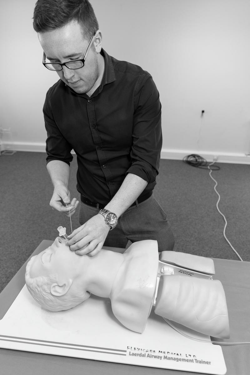 GB. WALES. Mountain Ash. Flexicare medical products. Jordan Thorne demonstrating an Endotracheal tube on dummy. 2013.