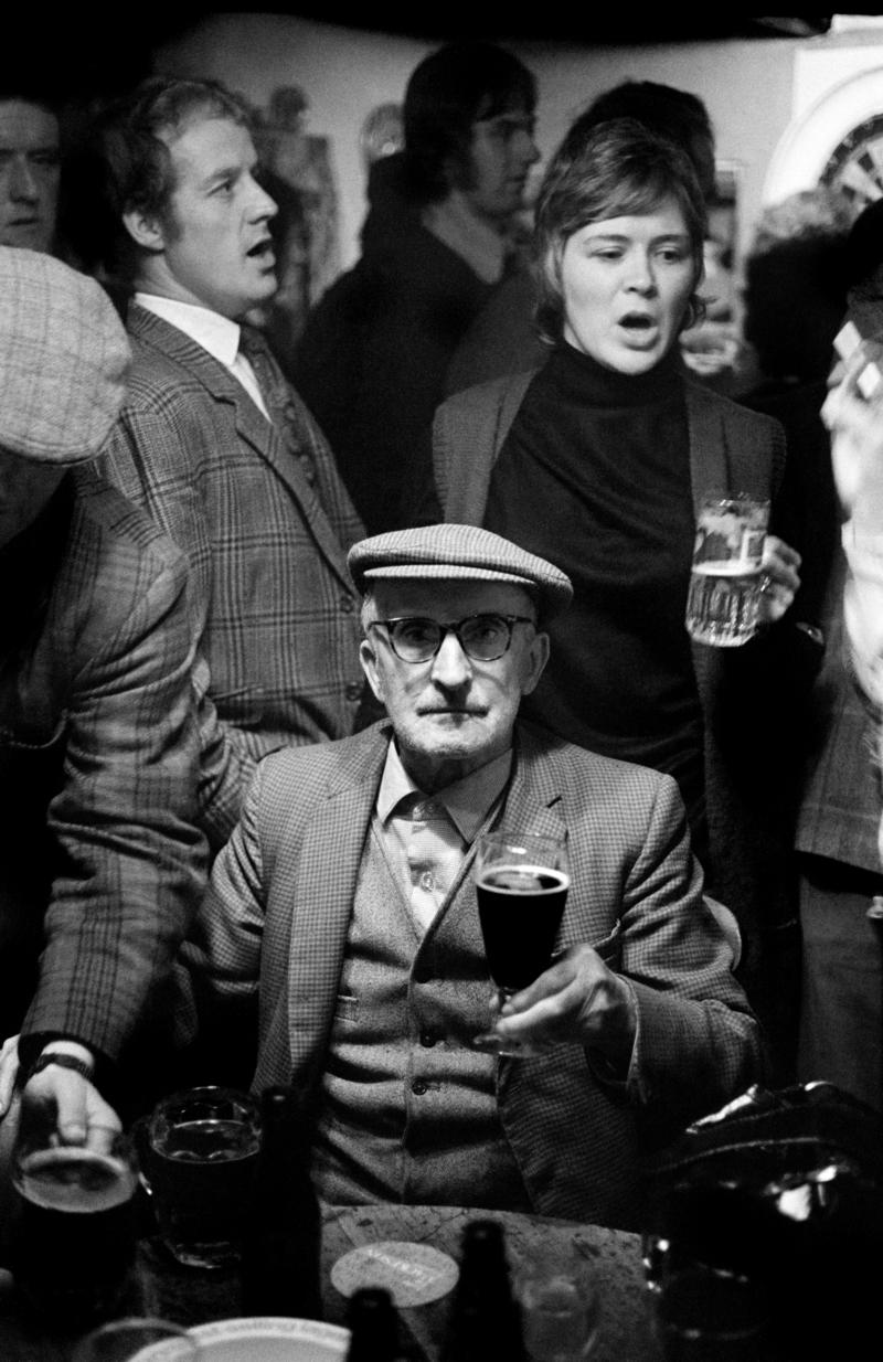 GB. WALES. Sennybridge. Pub sing-along. General.  A &#039;sing song&#039; in a local pub in the village of Sennybridge, Mid Wales.  The tradition of public singing springs from the fact that many of the community are or were members of choirs.  The choir linked to the Chapel is one of the least expensive mass cultural pastimes. 1973.