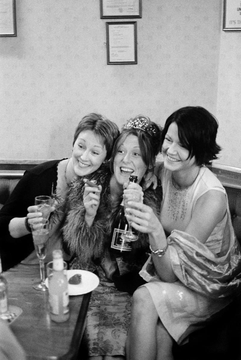 GB. WALES. Cardiff. Butetown - once know as &#039;Tiger Bay&#039;. The bride, Joanne, and two friends at her Wedding Reception in the Packet Pub, Bute Street, for Graham and Joanne Porter&#039;s Wedding. 2000