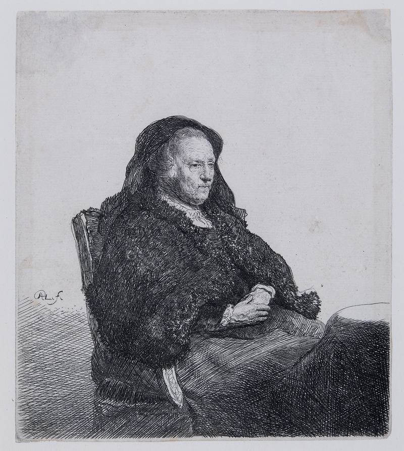 Rembrandt's mother seated at a table looking right