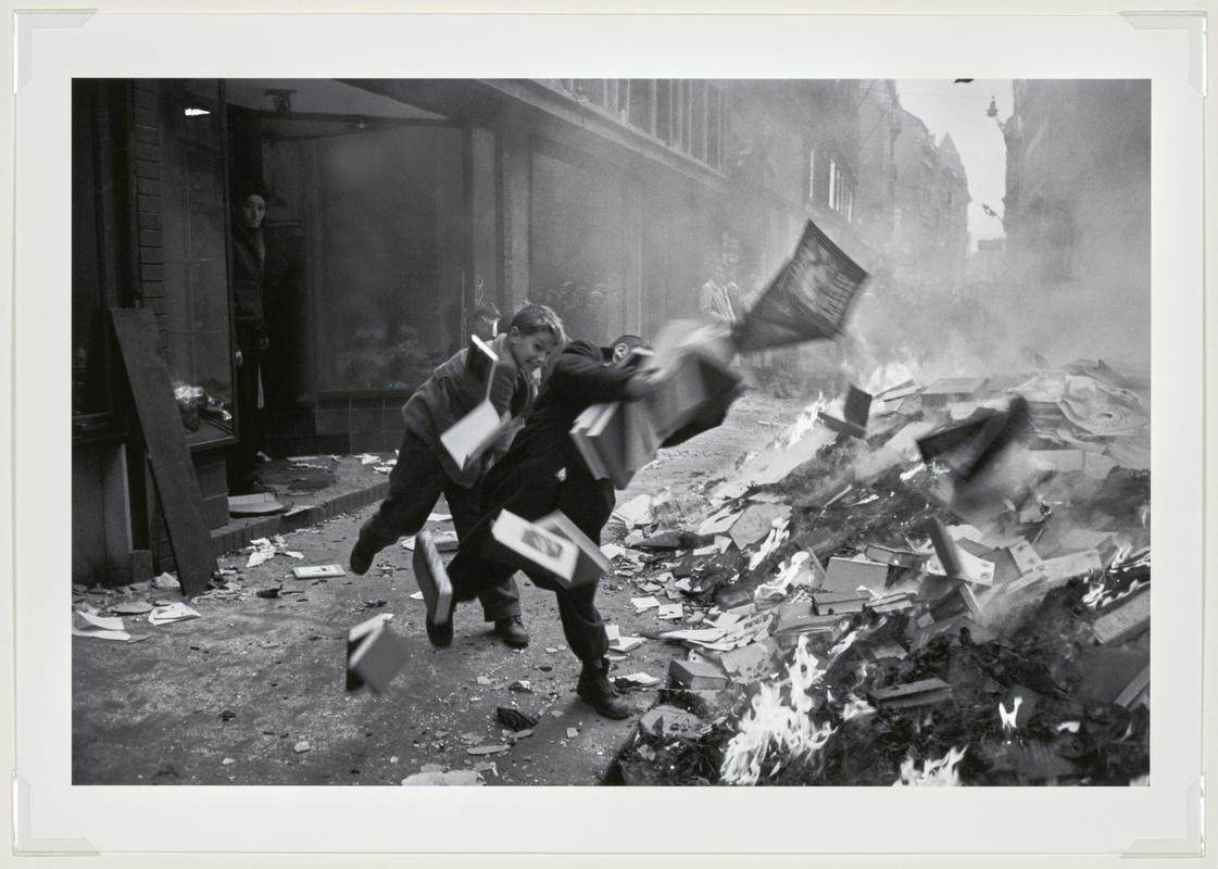 On Vaci Street angry crowds have stormed the Soviet Cultural shop and burnt the literature and propaganda material. Budapest, Hungary