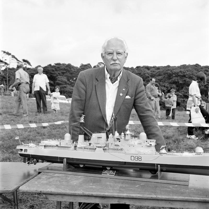 GB. WALES. Margam Park. Noel REYNOLDS, Retired RAF engineer with his model boat, HMS York, Destroyer. 1997