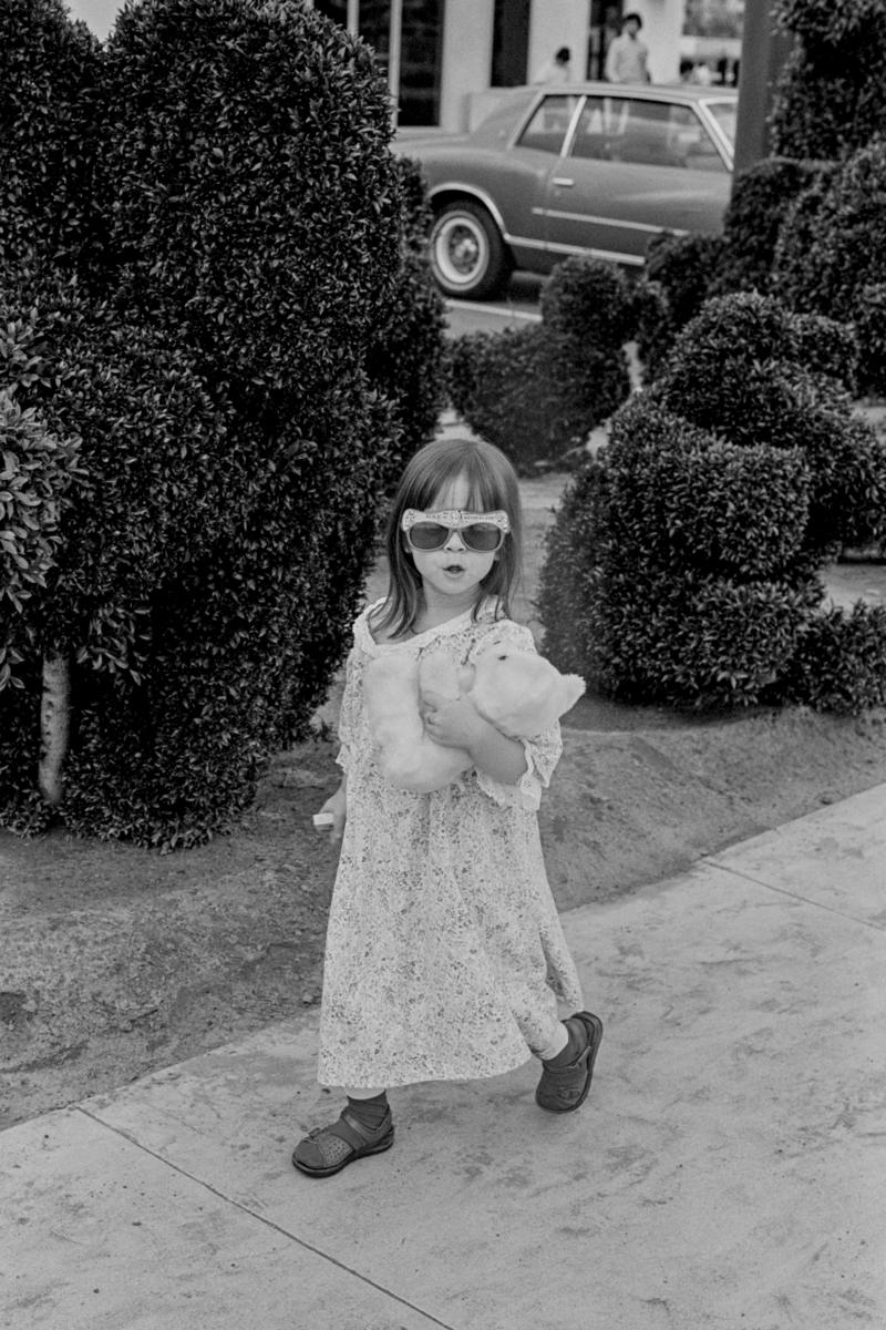 USA. CALIFORNIA. Venice Beach. Style for the young plus teddy bear. 1980.