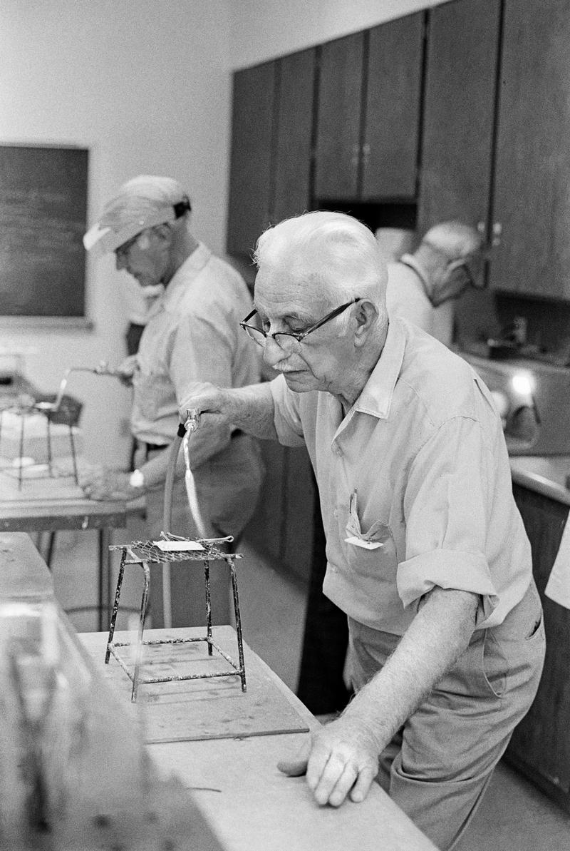 USA. ARIZONA. Sun City. Resident of Sun City at one of the wonderful clubs, in this case the Lapidary jewellery club. 1979.