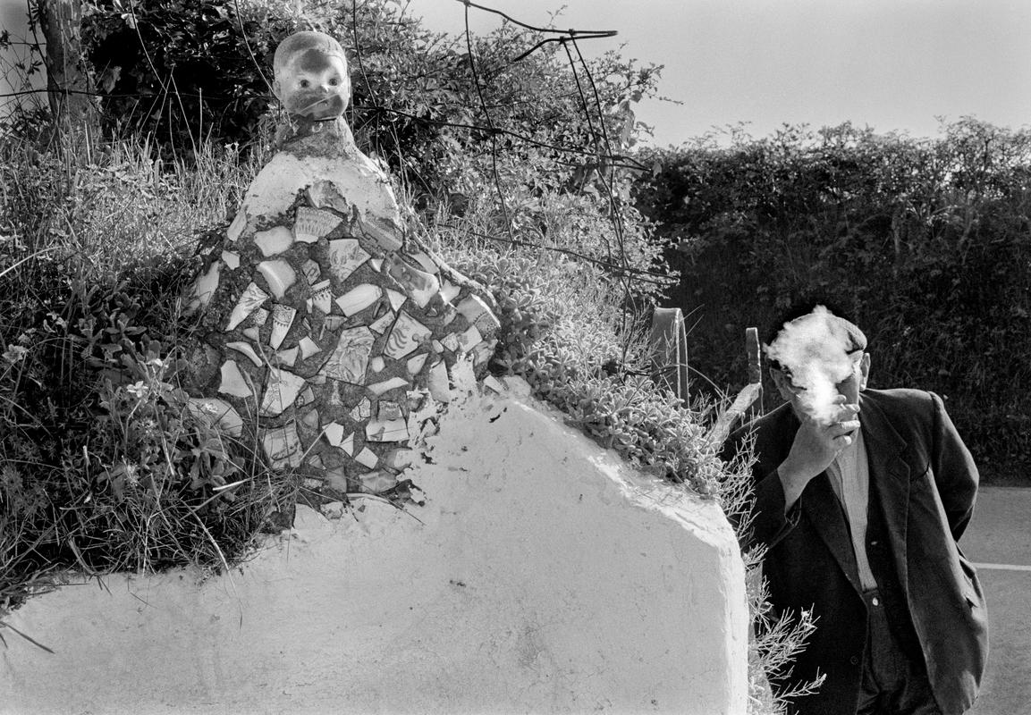 GB. WALES. Old farmer with primitive sculpture he made for his garden near Aber Eiddy(?) Mid Wales. 1974