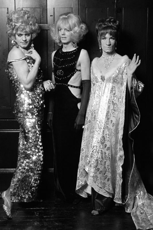 Black-and-white photograph of three drag queens