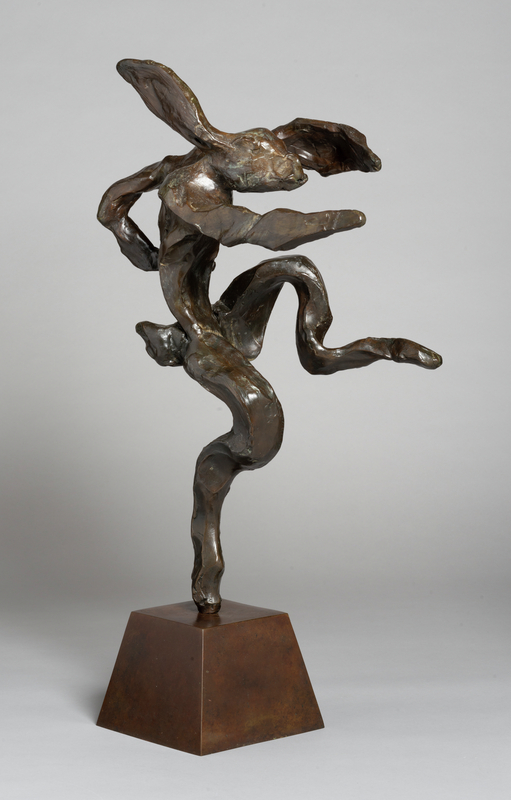 A bronze sculpture of a hare standing on one leg and posed as if it's dancing or boxing.