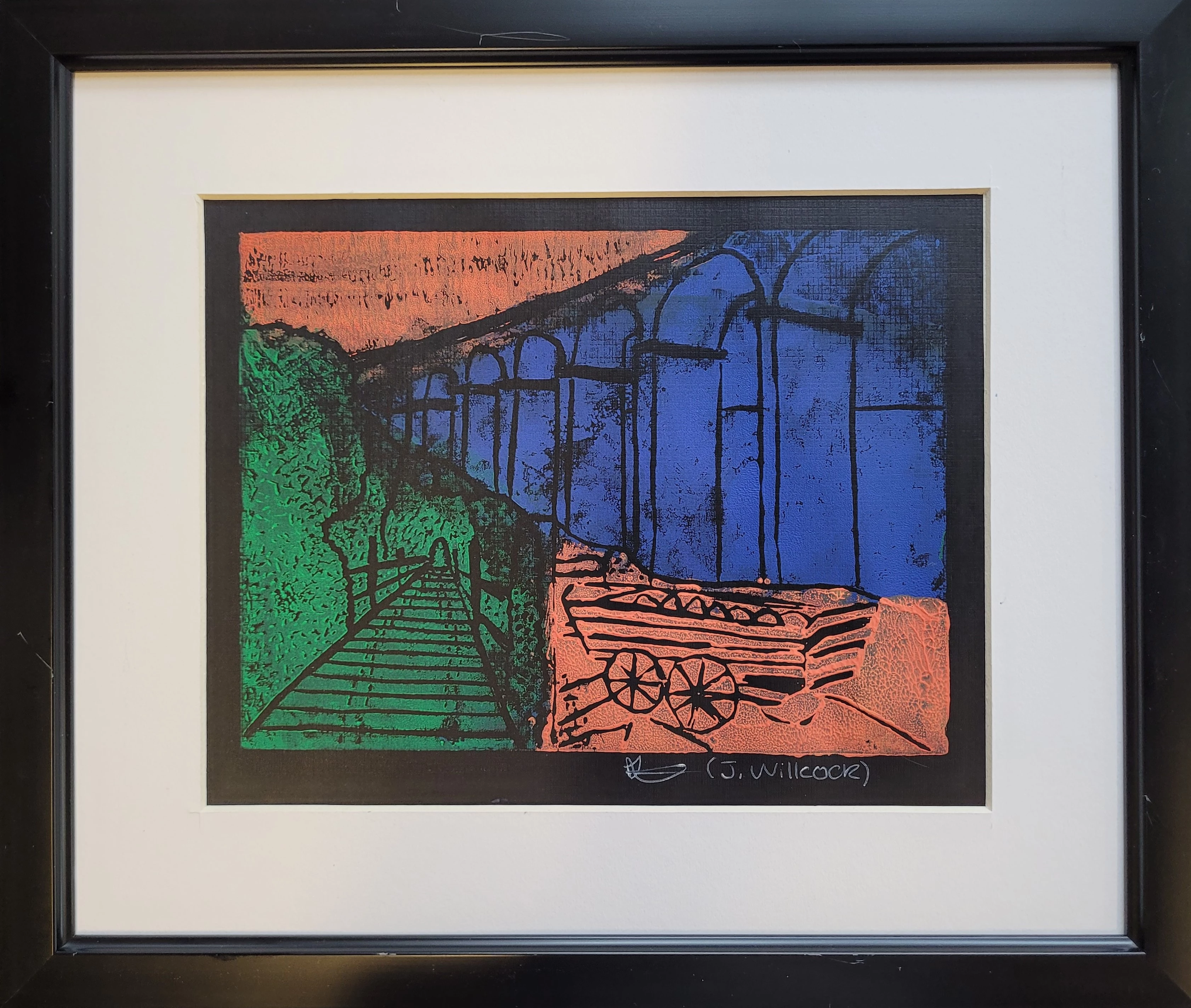 Lino print of viaduct with cart in three strong colours: green, blue and orange. The viaduct is blue.