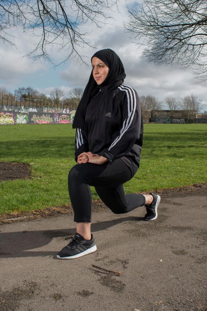 A woman in her exercise clothes in a park