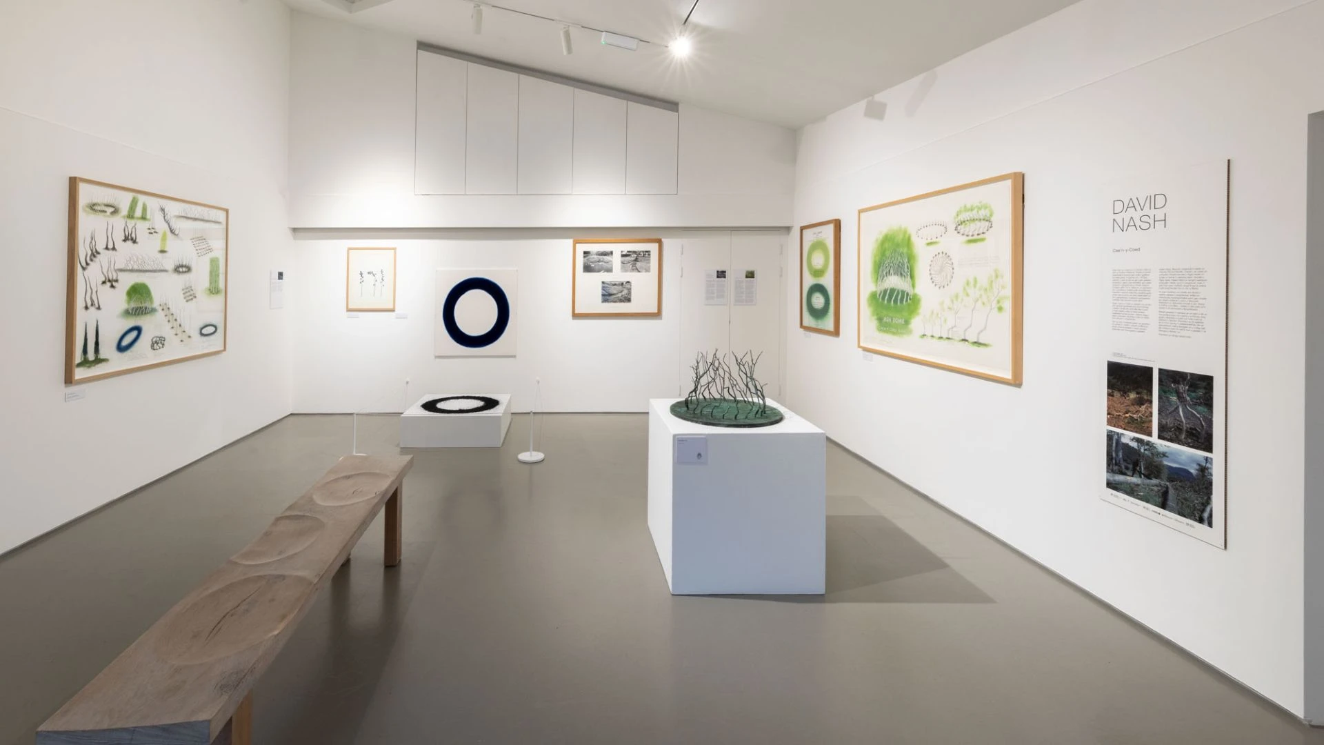 Gallery space with various prints on the walls.