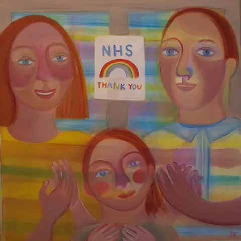 A colourful painting of a family with a poster thanking the NHS between them.